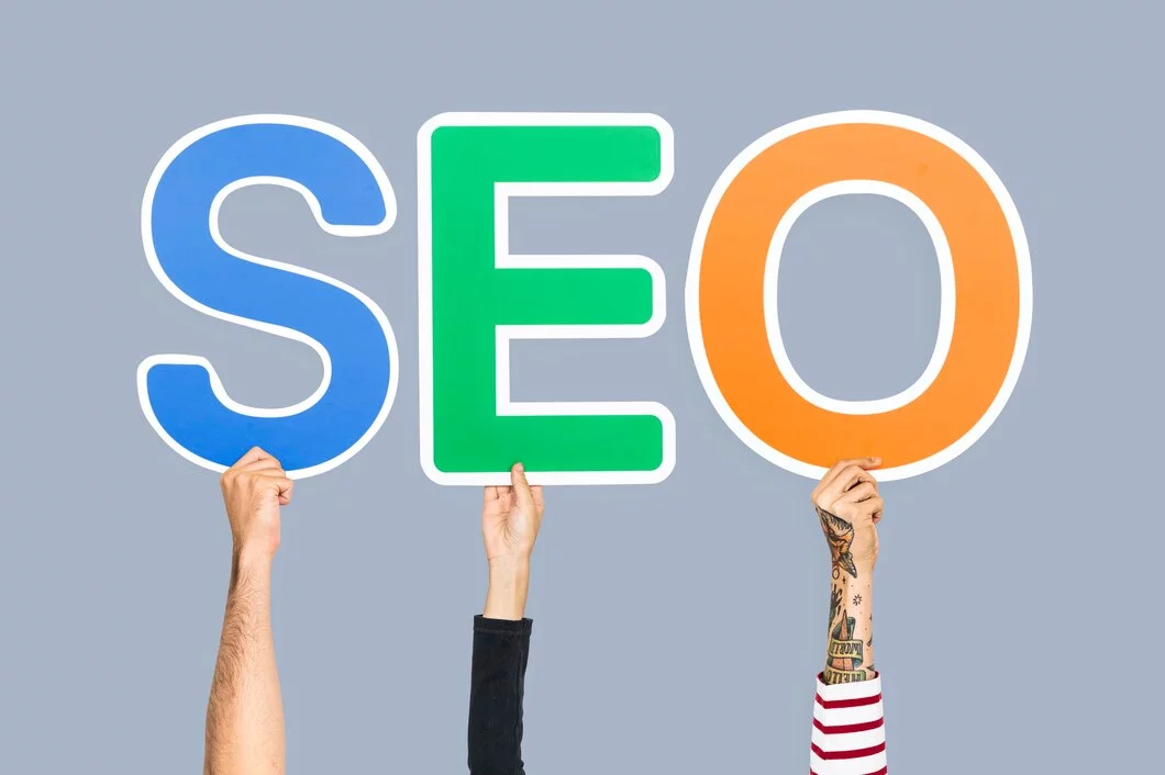 Hands holding up colorful letters forming abbreviation seo
