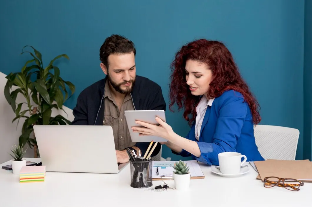Case Study: Boosting SEO for a Global Travel Company with High-Quality Link Building 44 man-and-woman-collaborating-and-discussing-over-a-tablet-in-an-office-setting