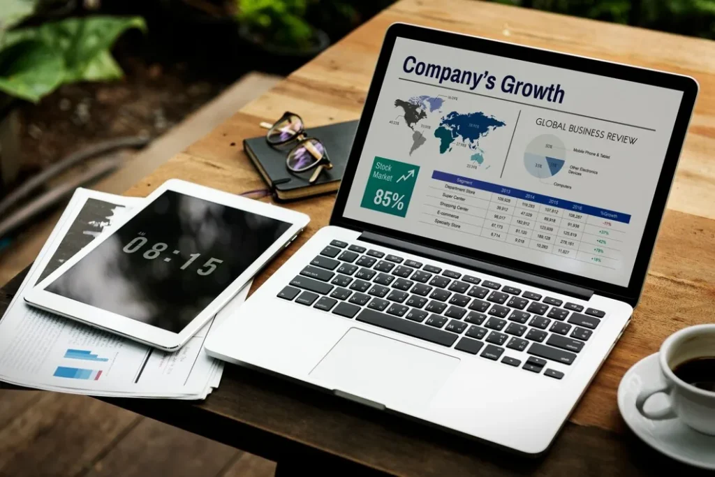 Case Study: Boosting SEO for a Global Travel Company with High-Quality Link Building 43 laptop-showing-companys-growth-report-with-global-business-review-and-stock-market-graph-on-screen