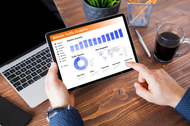 Case Study: Boosting SEO for a Global Travel Company with High-Quality Link Building 41 person-holding-tablet-displaying-website-traffic-analytics-with-charts
