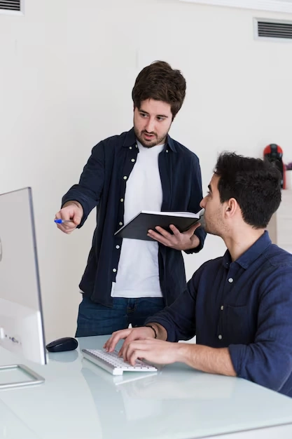 team-discussing-content-optimization-and-strategy-at-office-desk