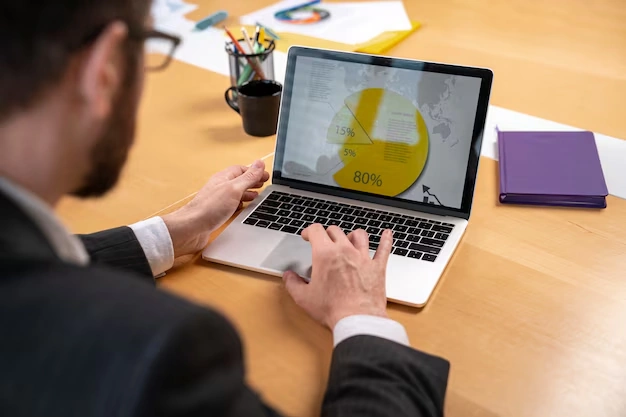 person-working-on-laptop-with-pie-chart-on-screen