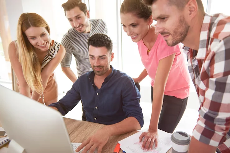 White hat link acquisition team collaborating on laptop developing ethical SEO backlink strategies
