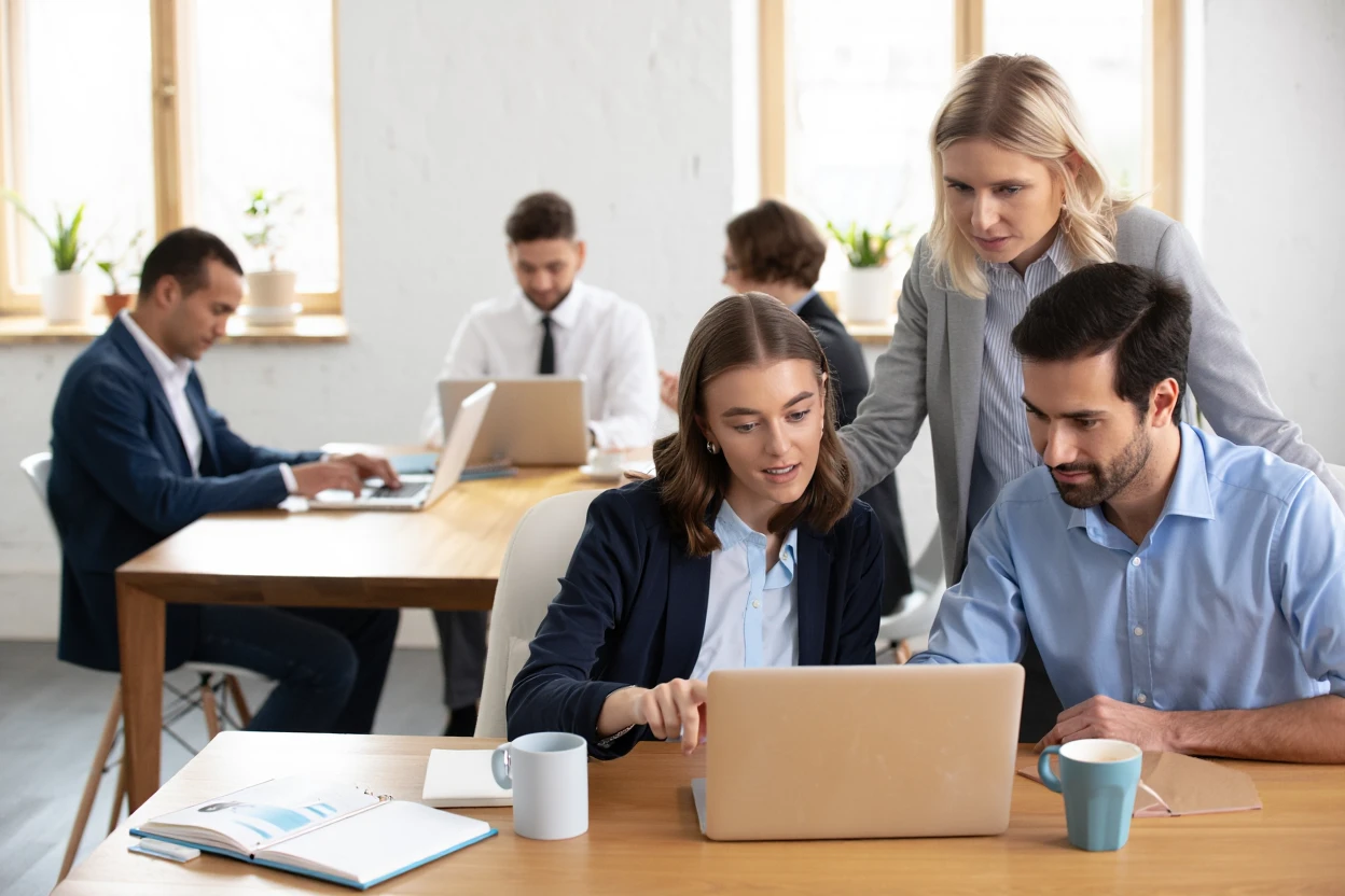 Professional SaaS marketing team collaborating on link building strategies in modern office workspace