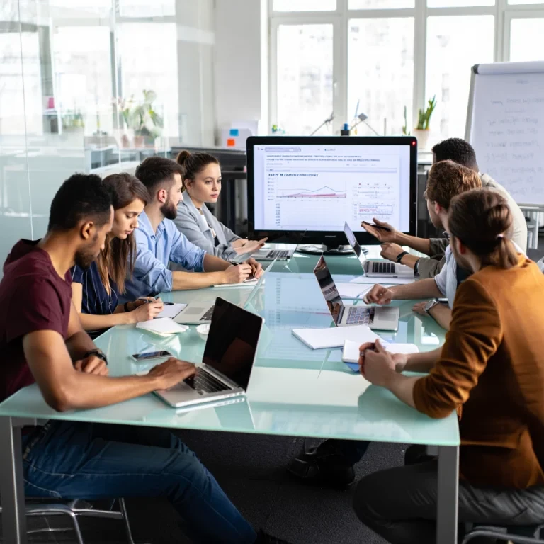 Team discussing analytics presentation at conference