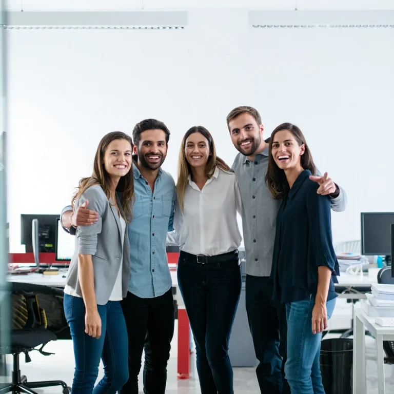 Professional team standing together in office